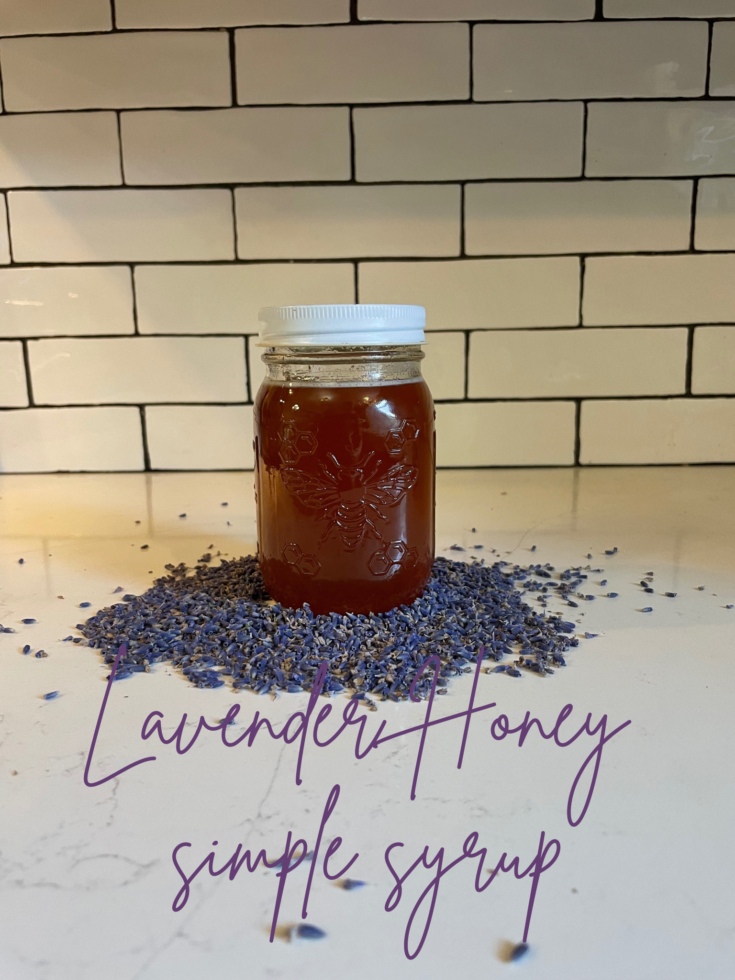 lavender honey simple syrup in a bee mason jar image