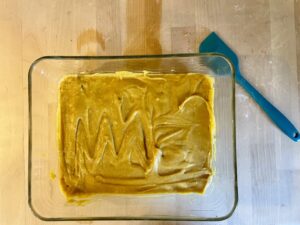 pumpkin bar batter in baking dish