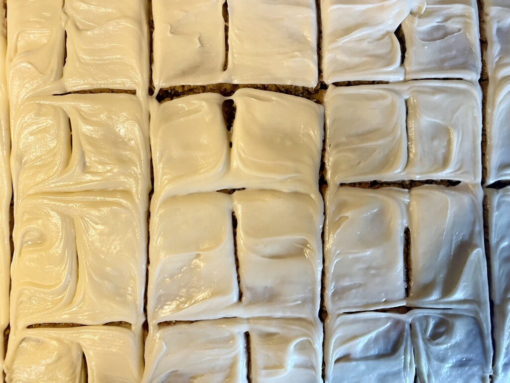 image of pumpkin spice dessert bars frosted with cream cheese frosting